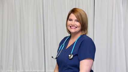 Portrait of a young attractive female healthcare professional, woman nurse
