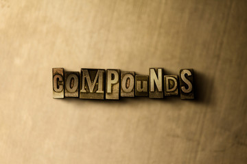 Naklejka premium COMPOUNDS - close-up of grungy vintage typeset word on metal backdrop. Royalty free stock illustration. Can be used for online banner ads and direct mail.