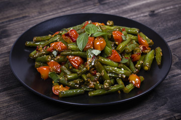 Healthy green beans, red cherry tomato with sesame seeds