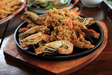 Fried shrimp with peppers, garlic and chilli recipe on hot iron