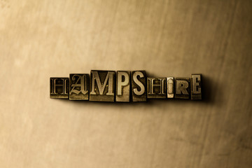 HAMPSHIRE - close-up of grungy vintage typeset word on metal backdrop. Royalty free stock illustration.  Can be used for online banner ads and direct mail.