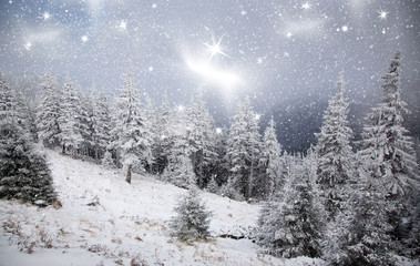 amazing winter sunrise through fog in the mountains