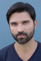 Obraz premium Handsome masculine manly male model facial hair macho strong dark stare