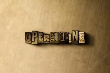 OPERATING - close-up of grungy vintage typeset word on metal backdrop. Royalty free stock illustration.  Can be used for online banner ads and direct mail.