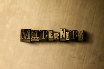 MATERNITY - close-up of grungy vintage typeset word on metal backdrop. Royalty free stock illustration.  Can be used for online banner ads and direct mail.