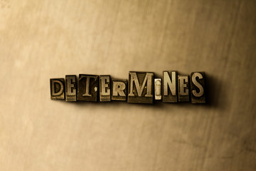 Naklejka premium DETERMINES - close-up of grungy vintage typeset word on metal backdrop. Royalty free stock illustration. Can be used for online banner ads and direct mail.