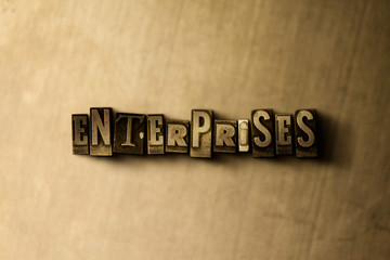 Fototapeta na wymiar ENTERPRISES - close-up of grungy vintage typeset word on metal backdrop. Royalty free stock illustration. Can be used for online banner ads and direct mail.