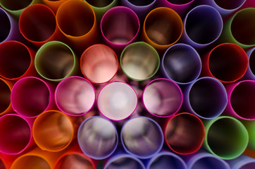 .Plastic straw color. A light shone through a circular pipe. Too