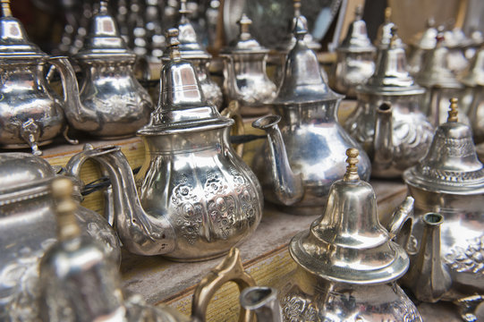 Traditional metal Moroccan mint tea pots for sale in the souks in the old Medina, Marrakech, Morocco 