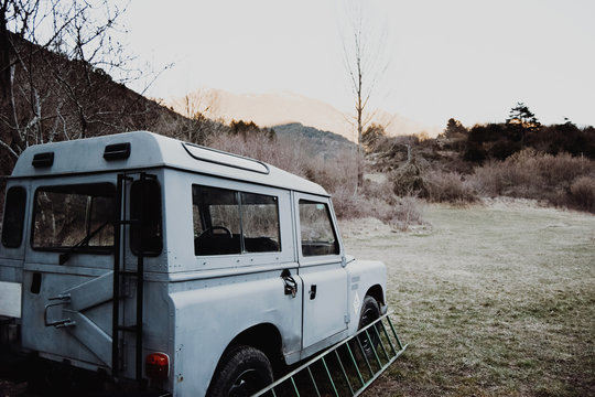 Back view of car in meadow