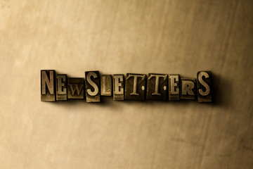 NEWSLETTERS - close-up of grungy vintage typeset word on metal backdrop. Royalty free stock illustration.  Can be used for online banner ads and direct mail.