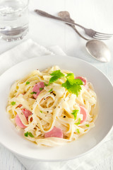 Alfredo tagliatelle pasta with sausages