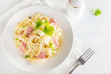 Alfredo tagliatelle pasta with sausages