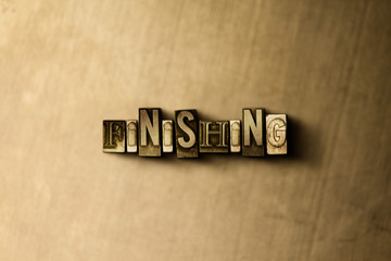 FINISHING - close-up of grungy vintage typeset word on metal backdrop. Royalty free stock illustration.  Can be used for online banner ads and direct mail.