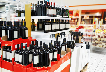 View of shelves with alcohol bottles in supermarket