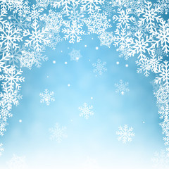 Naklejka na ściany i meble Flying snowflakes on blue background.