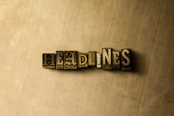 HEADLINES - close-up of grungy vintage typeset word on metal backdrop. Royalty free stock illustration.  Can be used for online banner ads and direct mail.