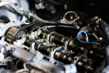 Fototapeta na wymiar Car mechanic repairing an internal combustion engine