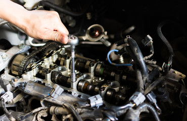 Hand with wrench. Mechanic. Auto repair shop.