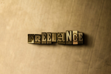 FREELANCE - close-up of grungy vintage typeset word on metal backdrop. Royalty free stock illustration.  Can be used for online banner ads and direct mail.