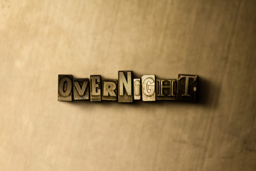 Obraz premium OVERNIGHT - close-up of grungy vintage typeset word on metal backdrop. Royalty free stock illustration. Can be used for online banner ads and direct mail.
