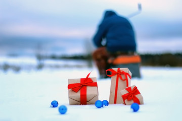 Naklejka premium gift box on the snow bow landscape