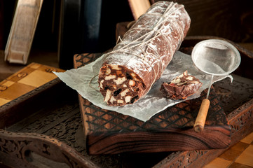 Chocolate salami served on a wooden board