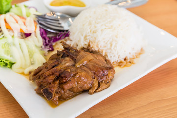 Roasted chicken with rice and vegetable salad.