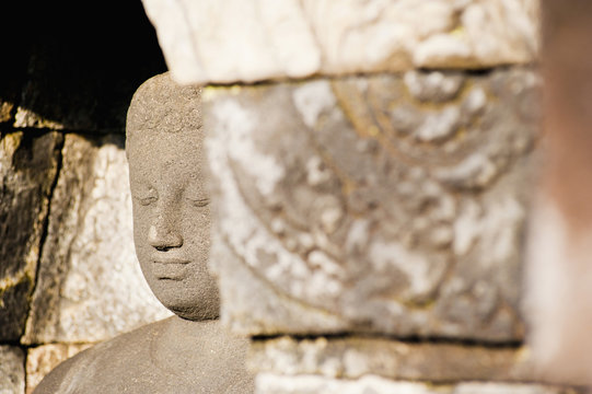 Close up of stone Buddha at Borobudur Temple, Java, Indonesia