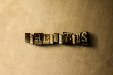 LIABILITIES - close-up of grungy vintage typeset word on metal backdrop. Royalty free stock illustration.  Can be used for online banner ads and direct mail.