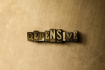 DEFENSIVE - close-up of grungy vintage typeset word on metal backdrop. Royalty free stock illustration.  Can be used for online banner ads and direct mail.