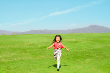 child running on beautiful field