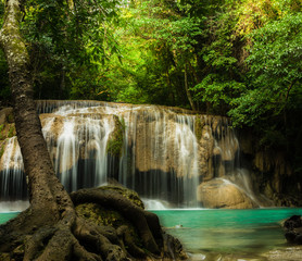 Fototapeta na wymiar Erawan waterfall, the beautiful waterfall in forest at Erawan National Park - A beautiful waterfall on the River Kwai. Kanchanaburi, Thailand
