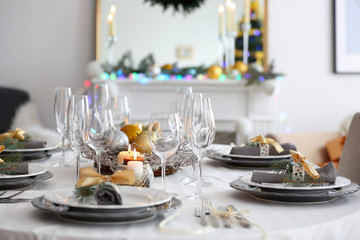 Table served for Christmas dinner in living room, close up view
