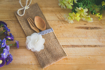 Yellow and Purple Flowers on Wooden Background 