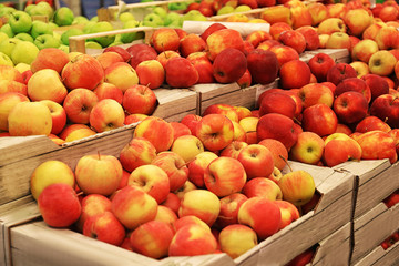 Boxes with fresh apples in supermarket
