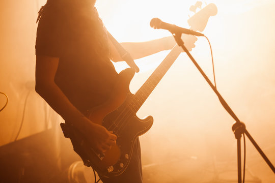 Silhouette of bass guitar player