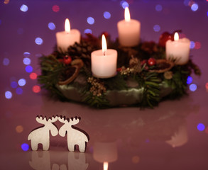 cute reindeer couple decoration with advent wreath on Holiday background. Christmas love