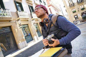 Photo reporter writing notes on photo tour