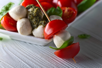  mozzarella with tomato , basil  and pesto sauce