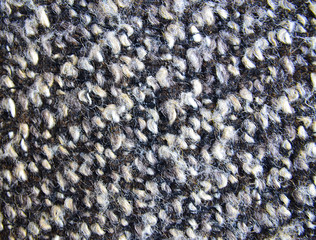 Varicolored tweed as a background or texture.Wool pattern,textured melange upholstery fabric background.
