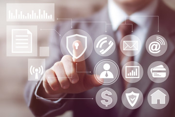 Businessman touch button shield security virus network communication