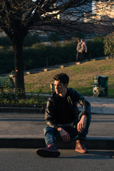 Fototapeta premium Beautiful young man posing in an urban context