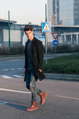 Beautiful young man posing in an urban context