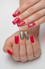 Christmas red manicure with gold and painted snowman, Christmas tree, Christmas toys 