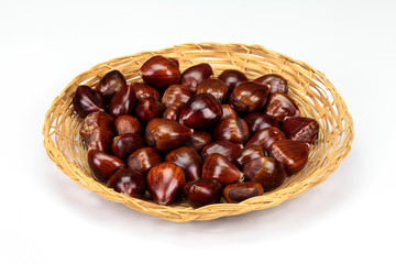 Chestnut (Castanea), in a wicker plate