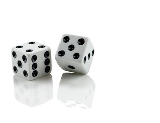 White dice on white with reflection