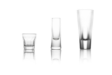 Three different liquor glasses on a white background