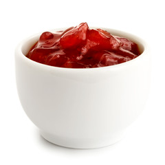 Red onion chutney in ceramic bowl isolated on white.