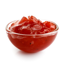 Red onion chutney in glass bowl isolated on white. - obrazy, fototapety, plakaty